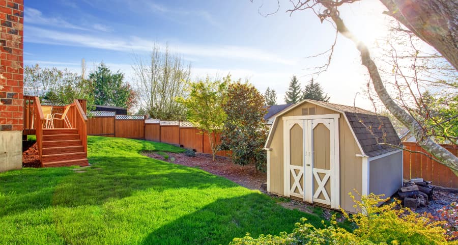 Fenced backyard with storage shed in Green Bay